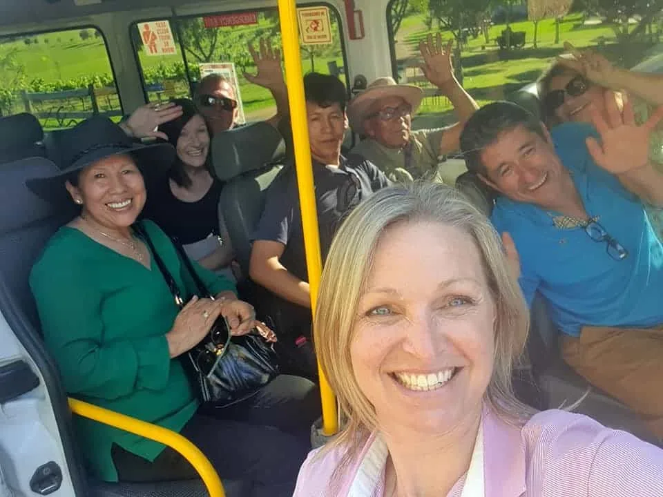 Your guide's selfie with a bus full of waving guests setting off on a Hunter Valley tour