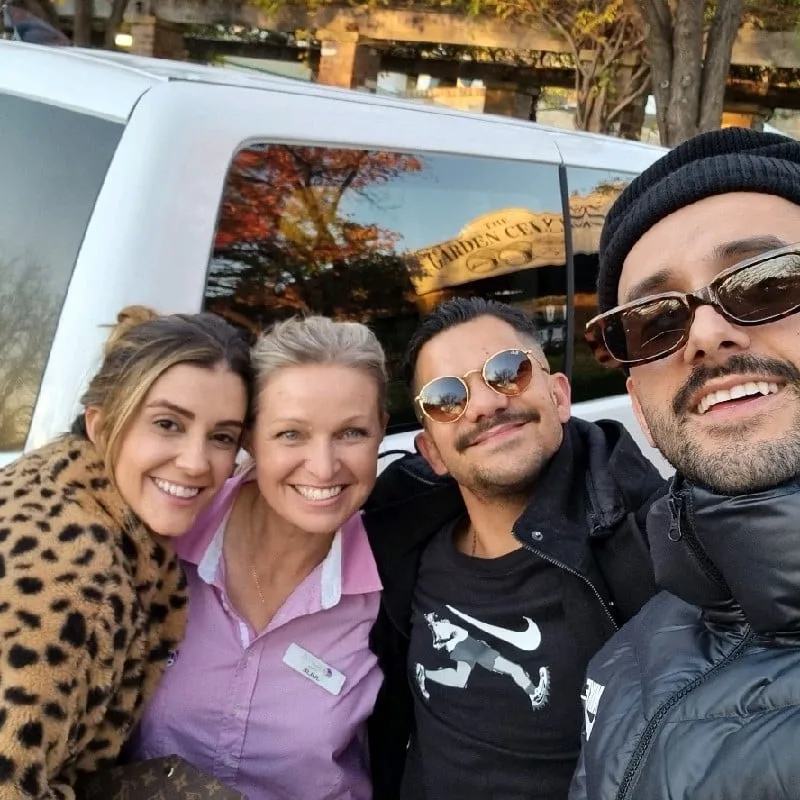 One of our tour guides with three guests beside the tour van at a Hunter Valley cellar door