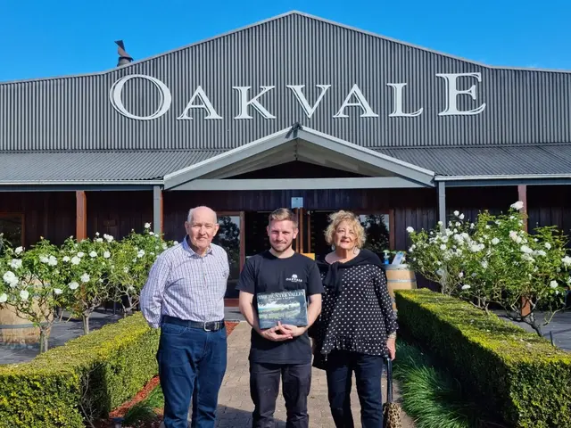 Guests outside the Oakvale cellar door with the rose hedge in flower