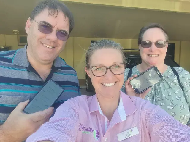 A Hunter Valley Tours guide in a selfie with two guests