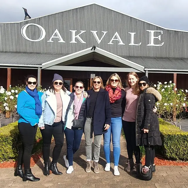 A group of guests rugged up outside the Oakvale cellar door