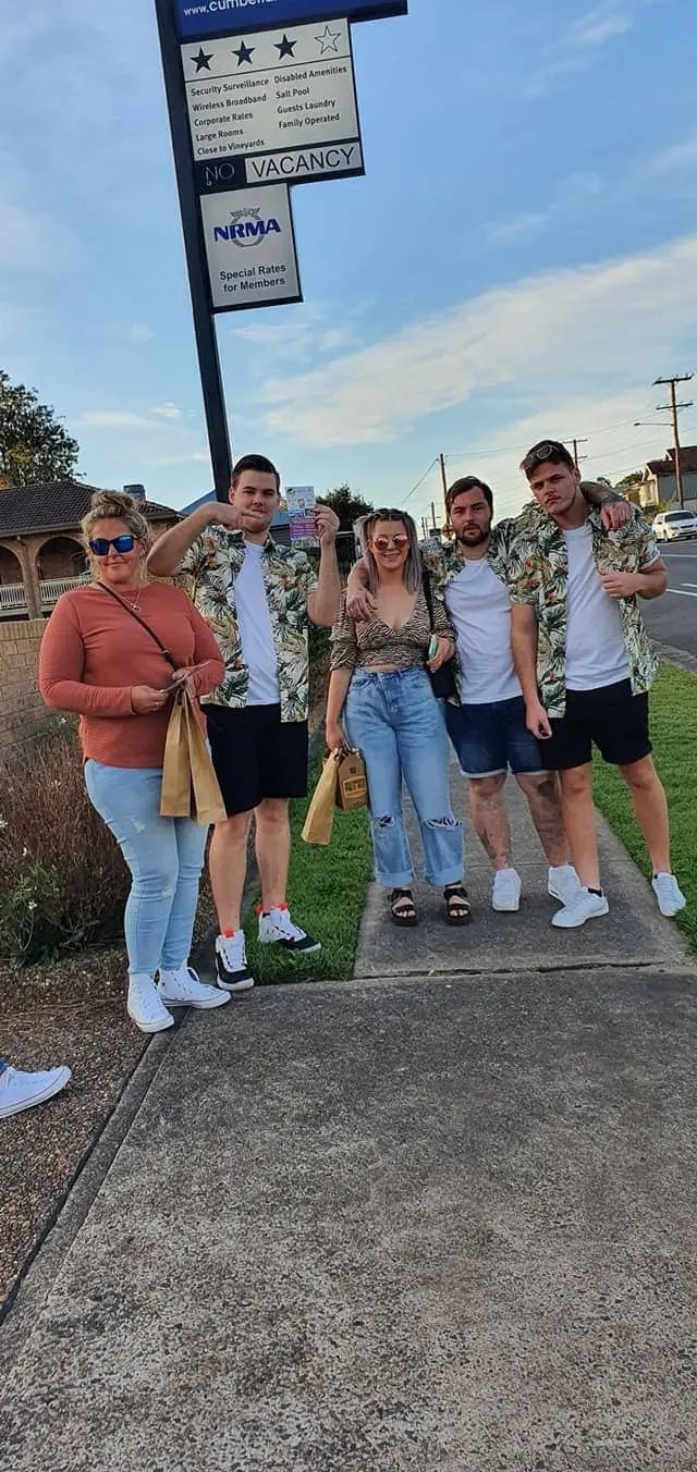 Guests on the footpath with their cellar door bags