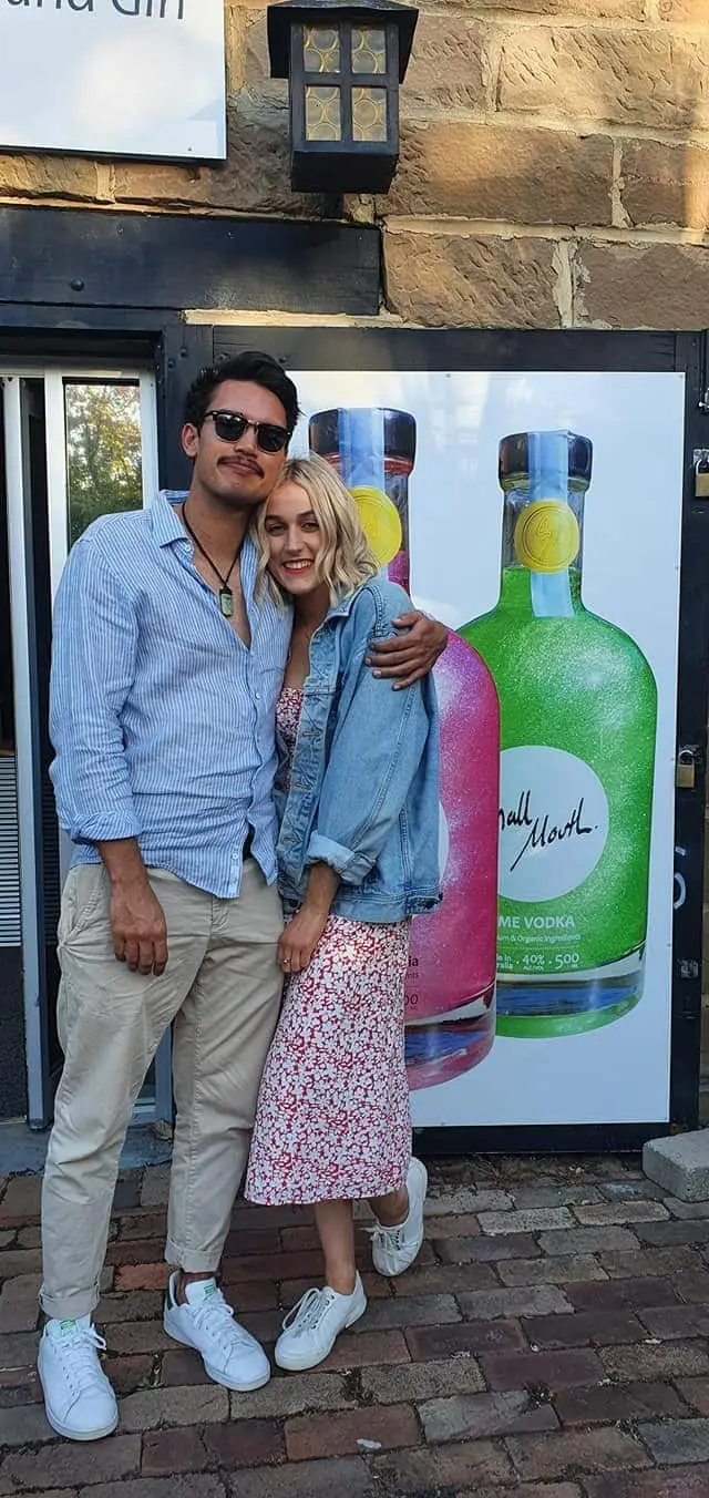 A couple outside a craft spirits cellar door