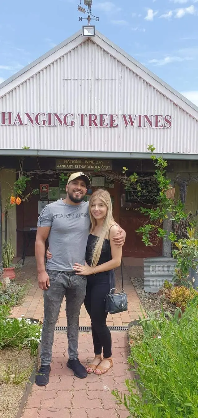A couple outside the Hanging Tree Wines cellar door
