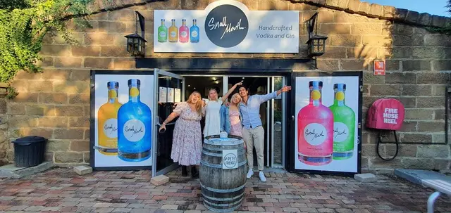 Guests in the doorway of a craft spirits cellar door
