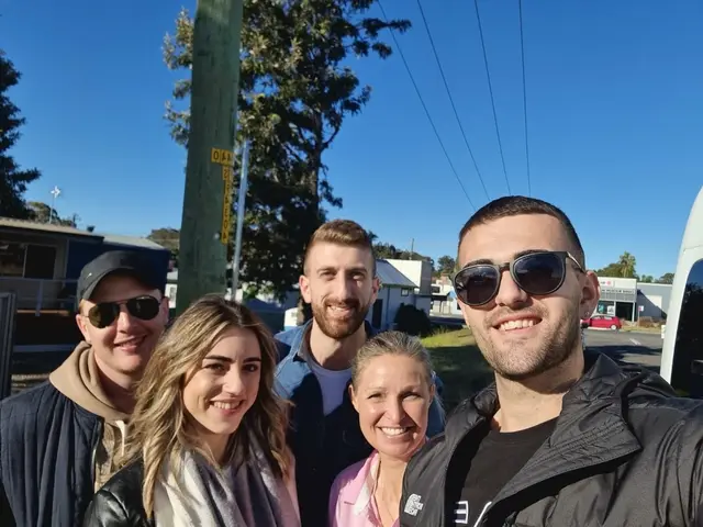 A guide and guests in a roadside selfie