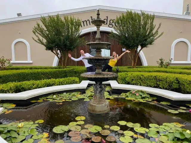 Guests at the fountain in a formal cellar door courtyard