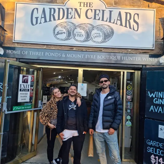 Guests in the doorway of The Garden Cellars